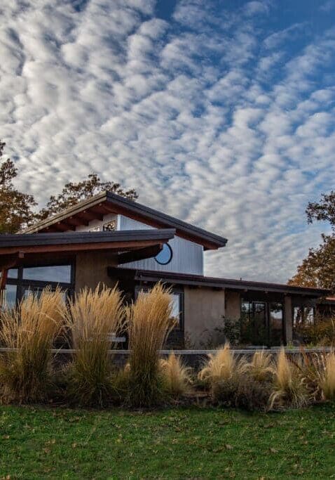 A clerestory roof is a roof with a vertical wall which sits between the two sloping sides, which features a row of windows (or one long, continuous window).